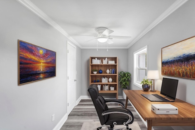 office space with ornamental molding, baseboards, wood finished floors, and ceiling fan