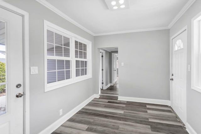 entryway featuring a healthy amount of sunlight, crown molding, baseboards, and dark wood-style flooring