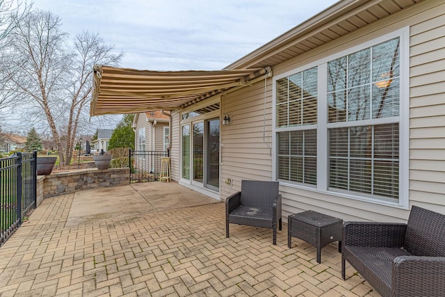 view of patio / terrace featuring fence