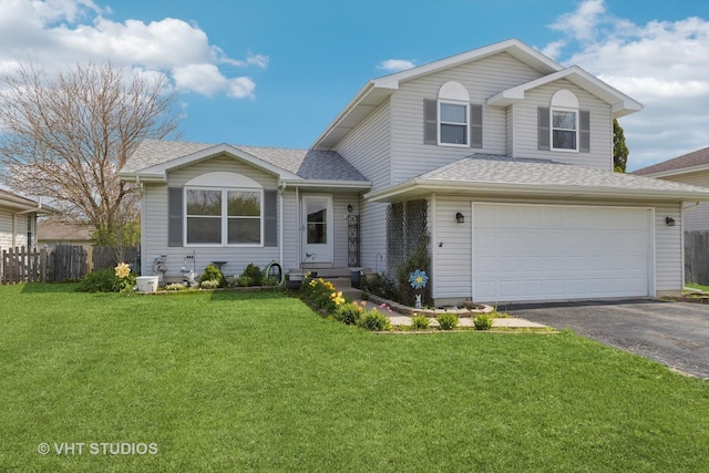 view of front facade featuring a front lawn, aphalt driveway, fence, roof with shingles, and an attached garage