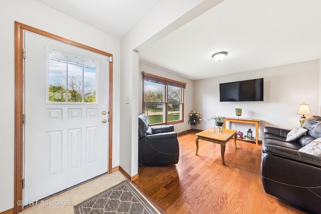 living room with light wood-style floors and baseboards