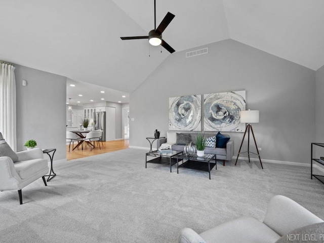 carpeted living area with a ceiling fan, baseboards, visible vents, and recessed lighting