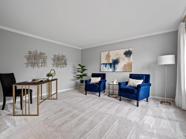 sitting room featuring carpet floors, ornamental molding, and baseboards