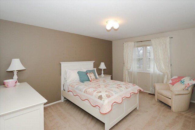 bedroom with light carpet