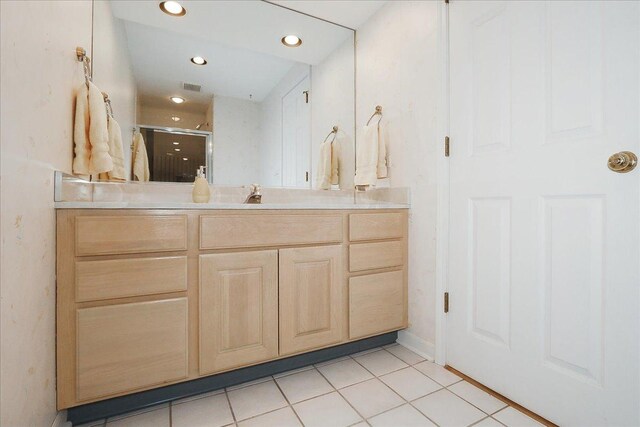 bathroom with a shower stall, tile patterned floors, vanity, visible vents, and recessed lighting