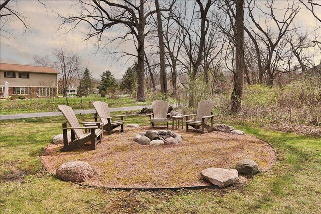 view of yard with an outdoor fire pit