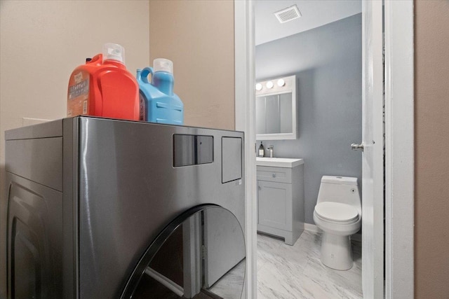 bathroom featuring toilet, marble finish floor, vanity, and visible vents