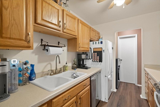kitchen with a sink, dishwasher, light countertops, dark wood-style floors, and a ceiling fan
