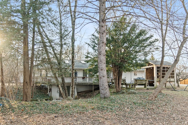 view of yard with an outdoor structure and a deck