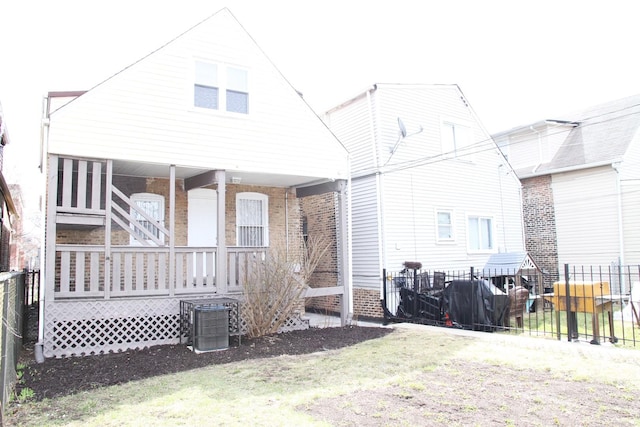 back of house featuring fence and central AC unit
