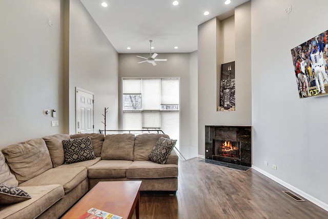 1622 W Ontario St Unit 1E, Chicago, IL 60622 - living area with ceiling fan, recessed lighting, a tiled fireplace, wood finished floors, and a high ceiling
