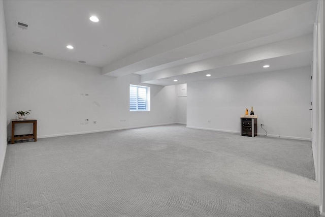 basement featuring carpet flooring, recessed lighting, visible vents, and baseboards