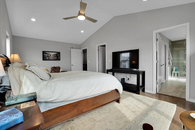 bedroom featuring lofted ceiling, visible vents, and recessed lighting