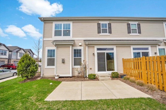 back of house with a patio, a yard, entry steps, and fence