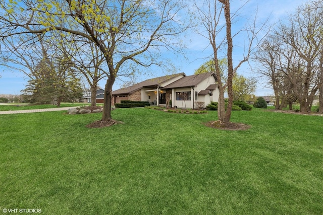 view of front of property with a front lawn