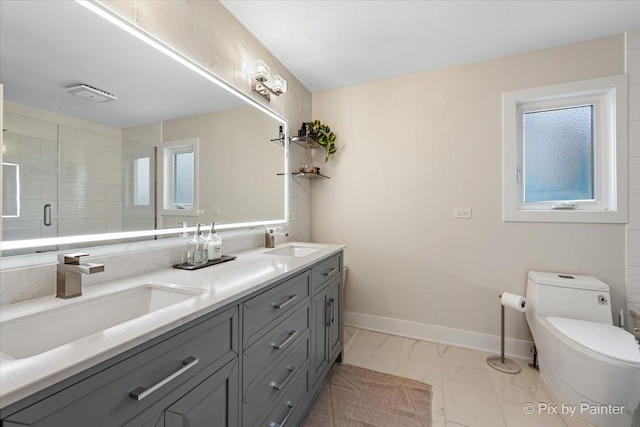 1682 Brompton Ln, Crystal Lake, IL 60014 - bathroom featuring toilet, a shower stall, a sink, and marble finish floor