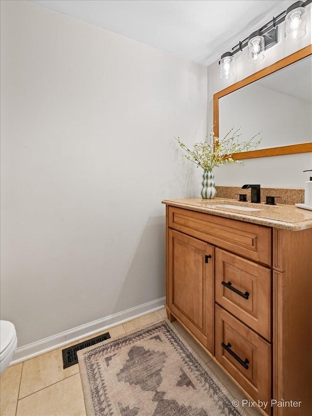 1682 Brompton Ln, Crystal Lake, IL 60014 - half bathroom featuring visible vents, tile patterned floors, baseboards, vanity, and toilet