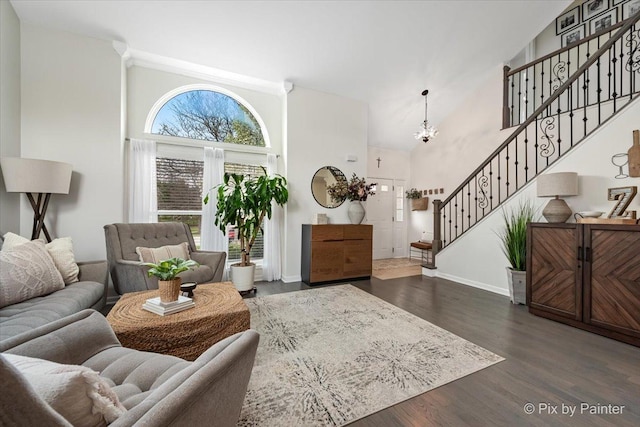 1682 Brompton Ln, Crystal Lake, IL 60014 - living area with a towering ceiling, wood finished floors, baseboards, stairway, and a notable chandelier