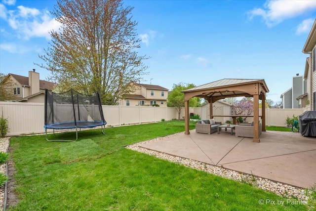 1682 Brompton Ln, Crystal Lake, IL 60014 - view of yard with a trampoline, a gazebo, outdoor lounge area, a fenced backyard, and a patio area