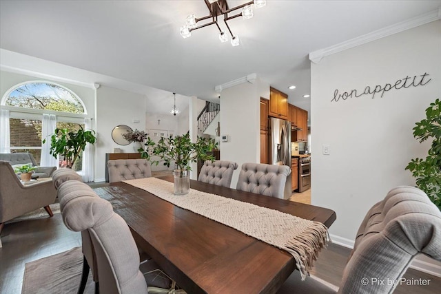 1682 Brompton Ln, Crystal Lake, IL 60014 - dining area with an inviting chandelier, ornamental molding, stairs, baseboards, and light wood-style flooring