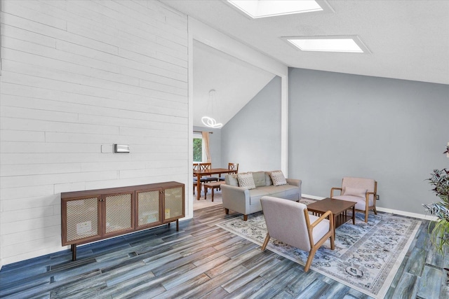 living room with wood finished floors and baseboards