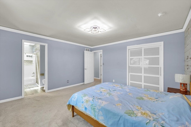 carpeted bedroom featuring crown molding and baseboards