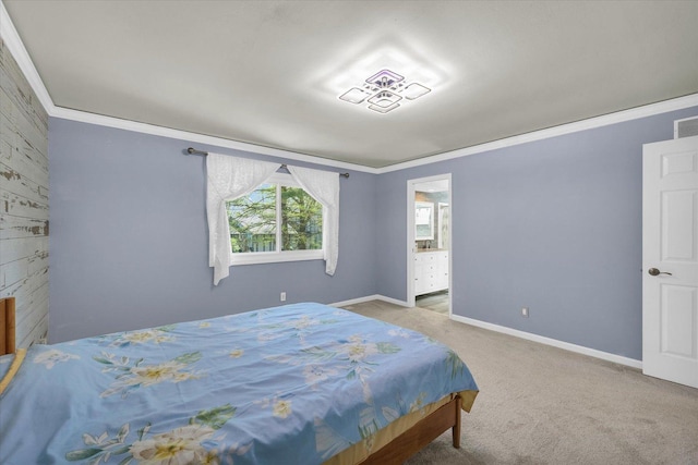 carpeted bedroom with crown molding and baseboards