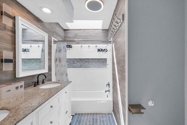 full bathroom with shower / tub combo and double vanity