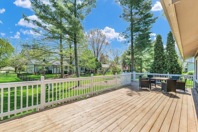 wooden terrace with a yard