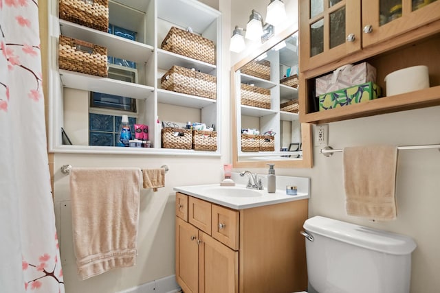 full bath featuring toilet and vanity