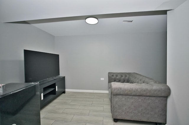 sitting room featuring visible vents and baseboards