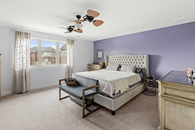 bedroom with ornamental molding, ceiling fan, and light colored carpet