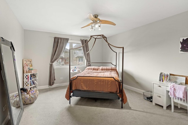 bedroom with a ceiling fan, carpet, and baseboards