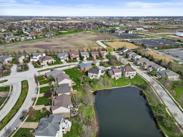 birds eye view of property with a residential view and a water view