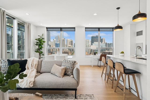421 W Huron St Unit 1504, Chicago, IL 60654 - living area with a skyline view, plenty of natural light, light wood finished floors, and recessed lighting