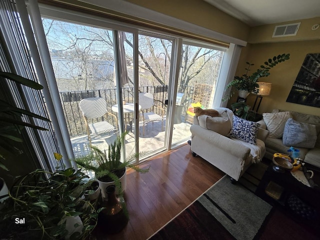 5201 Carriageway Dr Unit 315, Rolling Meadows, IL 60008 - living area featuring visible vents, plenty of natural light, and dark wood-type flooring