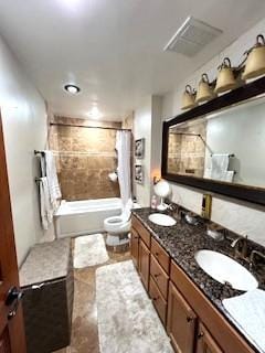 5201 Carriageway Dr Unit 315, Rolling Meadows, IL 60008 - full bathroom featuring double vanity, visible vents, a sink, toilet, and shower / tub combo with curtain