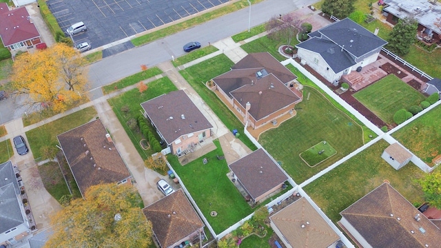 birds eye view of property with a residential view