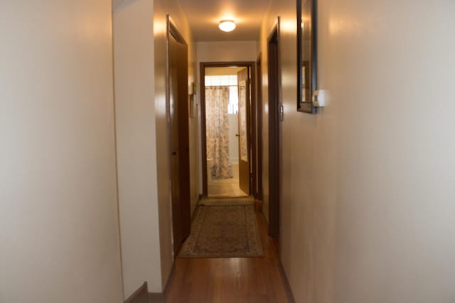 corridor with wood finished floors