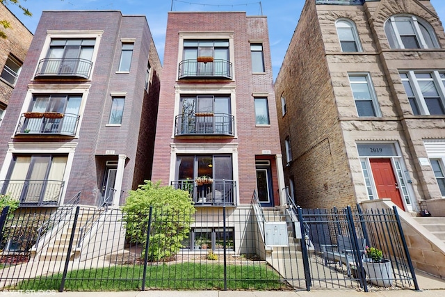 view of building exterior featuring a fenced front yard