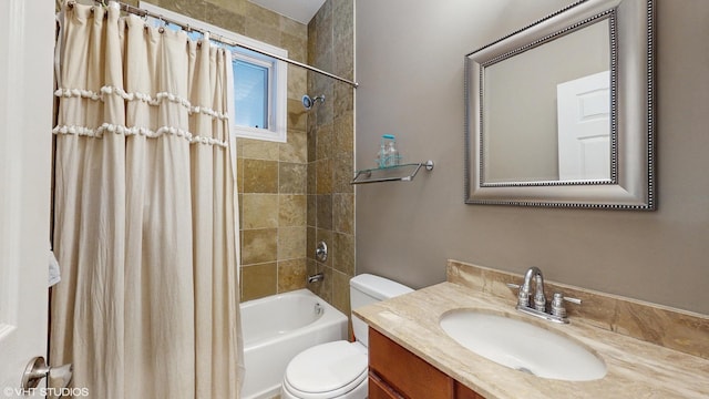 bathroom with vanity, toilet, and shower / bath combo with shower curtain