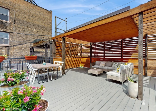deck with outdoor dining area and outdoor lounge area