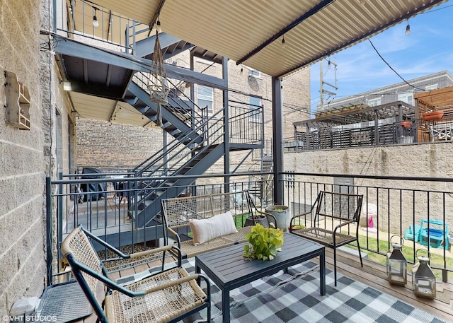 balcony featuring stairs