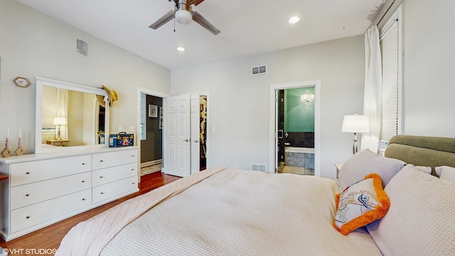 bedroom with recessed lighting, visible vents, and wood finished floors