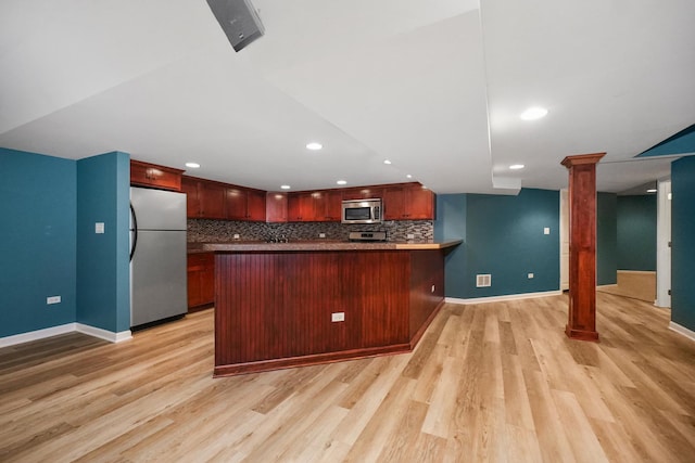 4240 Kingshill Cir, Naperville, IL 60564 - kitchen featuring appliances with stainless steel finishes, light wood-style flooring, backsplash, a peninsula, and recessed lighting