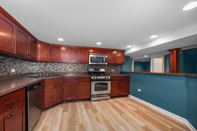 4240 Kingshill Cir, Naperville, IL 60564 - kitchen with appliances with stainless steel finishes, light wood-style floors, dark countertops, decorative backsplash, and recessed lighting