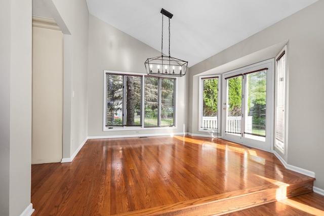 4240 Kingshill Cir, Naperville, IL 60564 - unfurnished dining area with a chandelier, wood finished floors, and high vaulted ceiling