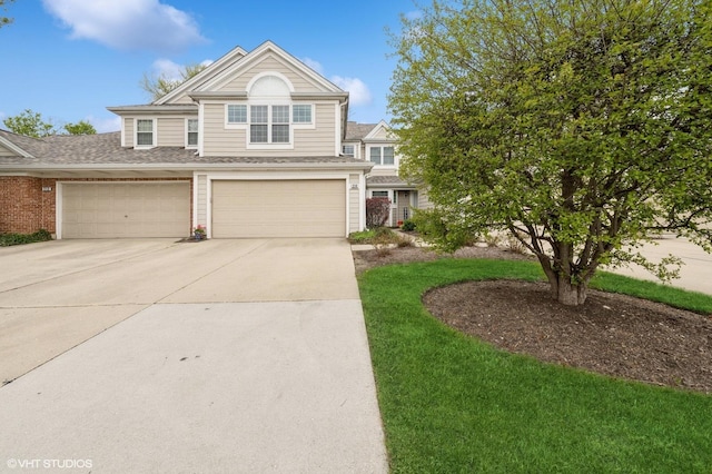 214 Woodstone Dr, Buffalo Grove, IL 60089 - view of front of property featuring an attached garage and concrete driveway