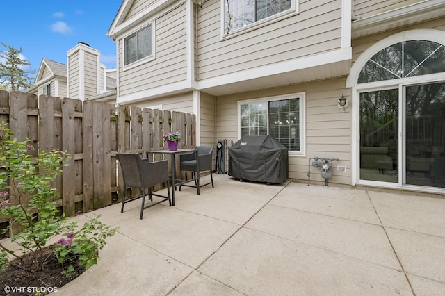 214 Woodstone Dr, Buffalo Grove, IL 60089 - view of patio with area for grilling, fence, and outdoor dining area
