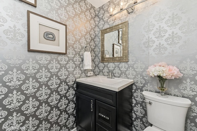 214 Woodstone Dr, Buffalo Grove, IL 60089 - bathroom featuring vanity, toilet, and wallpapered walls